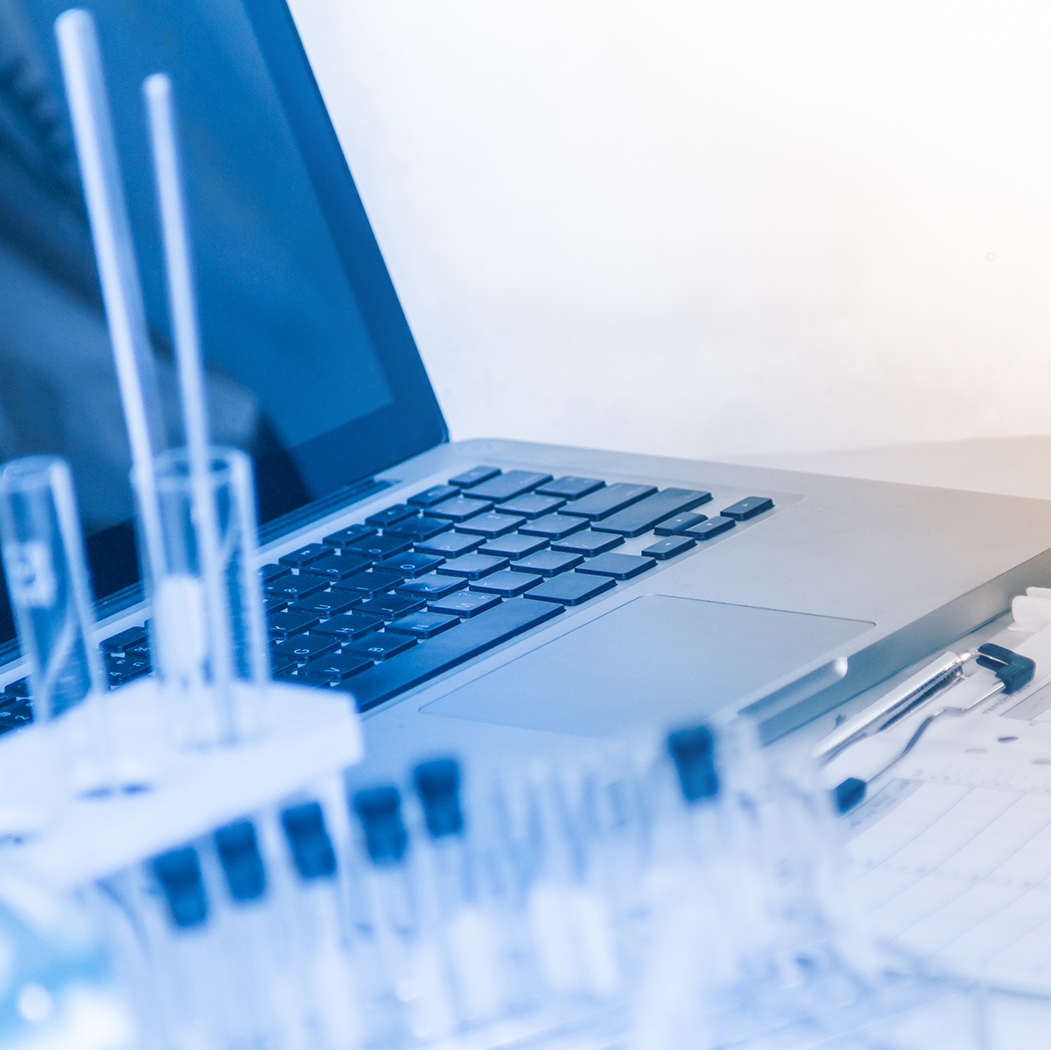 laptop and specimen bottles